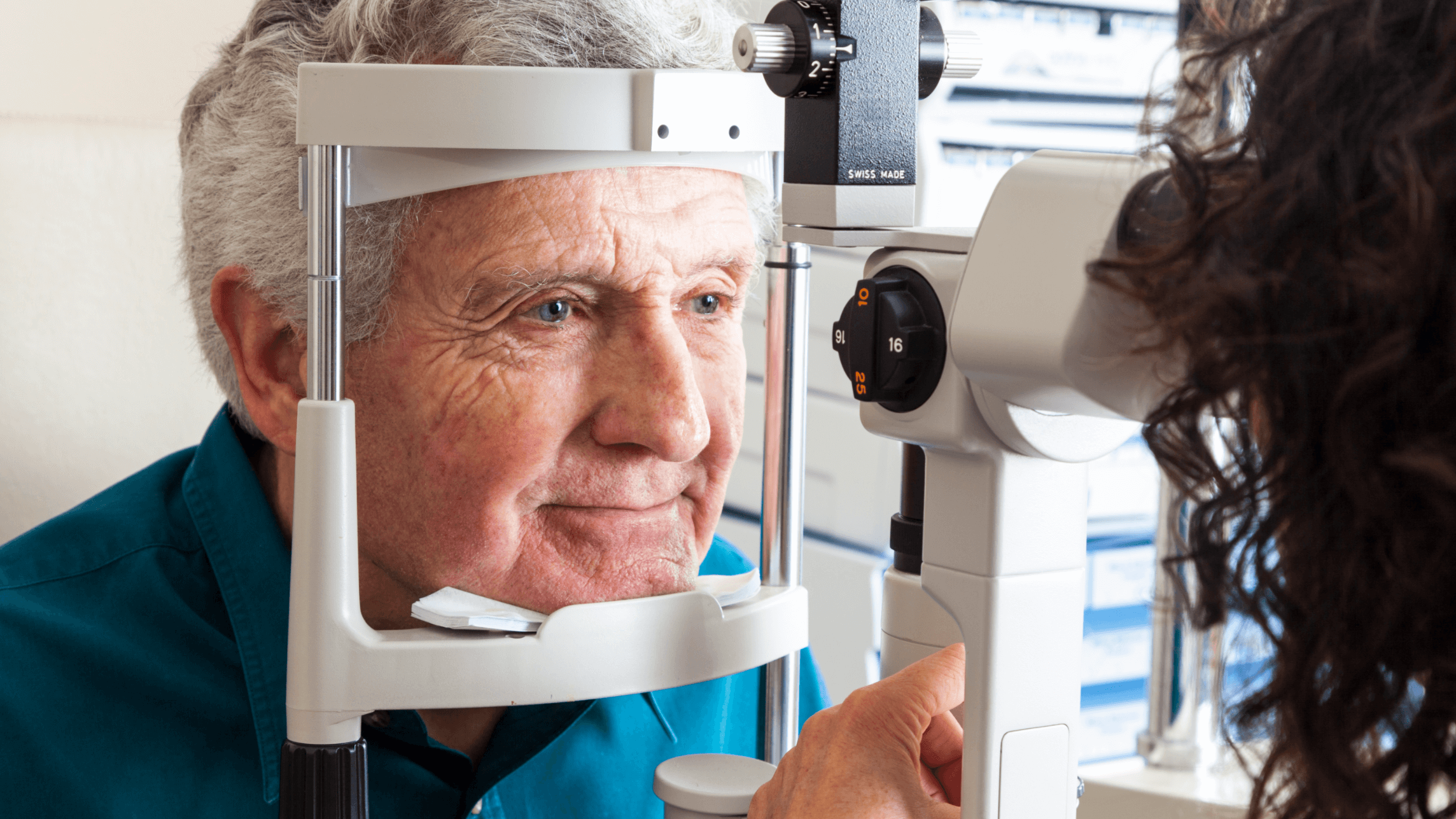 man getting eyes examined